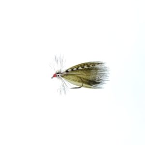 A tied fly with green feathers used for fly fishing.