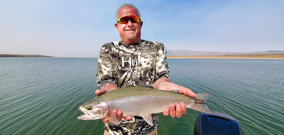 A brown trout from Crowley Lake on a center console bay boat with Sierra Drifters