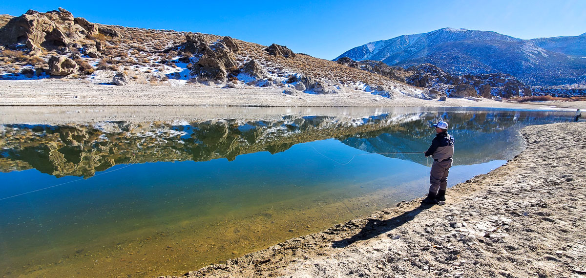 A fly fisherman fishing on Crowley lake in early November.