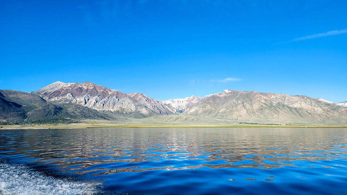 A mountain background with a large lake.