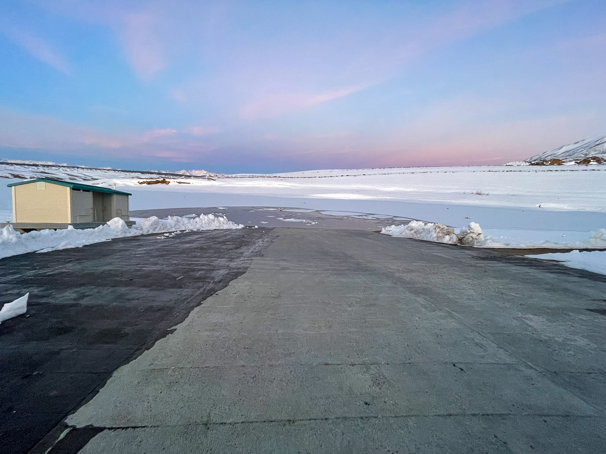 The launch ramp at Crowley Lake in April of 2023 with the lake frozen.