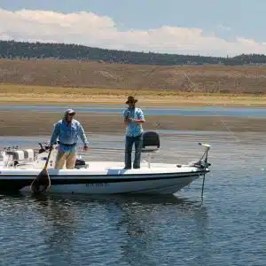A drift boat from an Eastern Sierra Fishing Guide on the banks of the Lower Owens River near Bishop, CA.