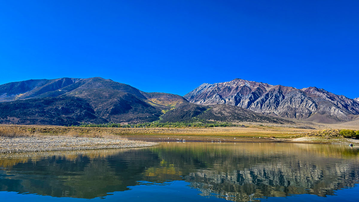 A view of tall mountains from Crowley Lake in the eastern sierra in California in October.